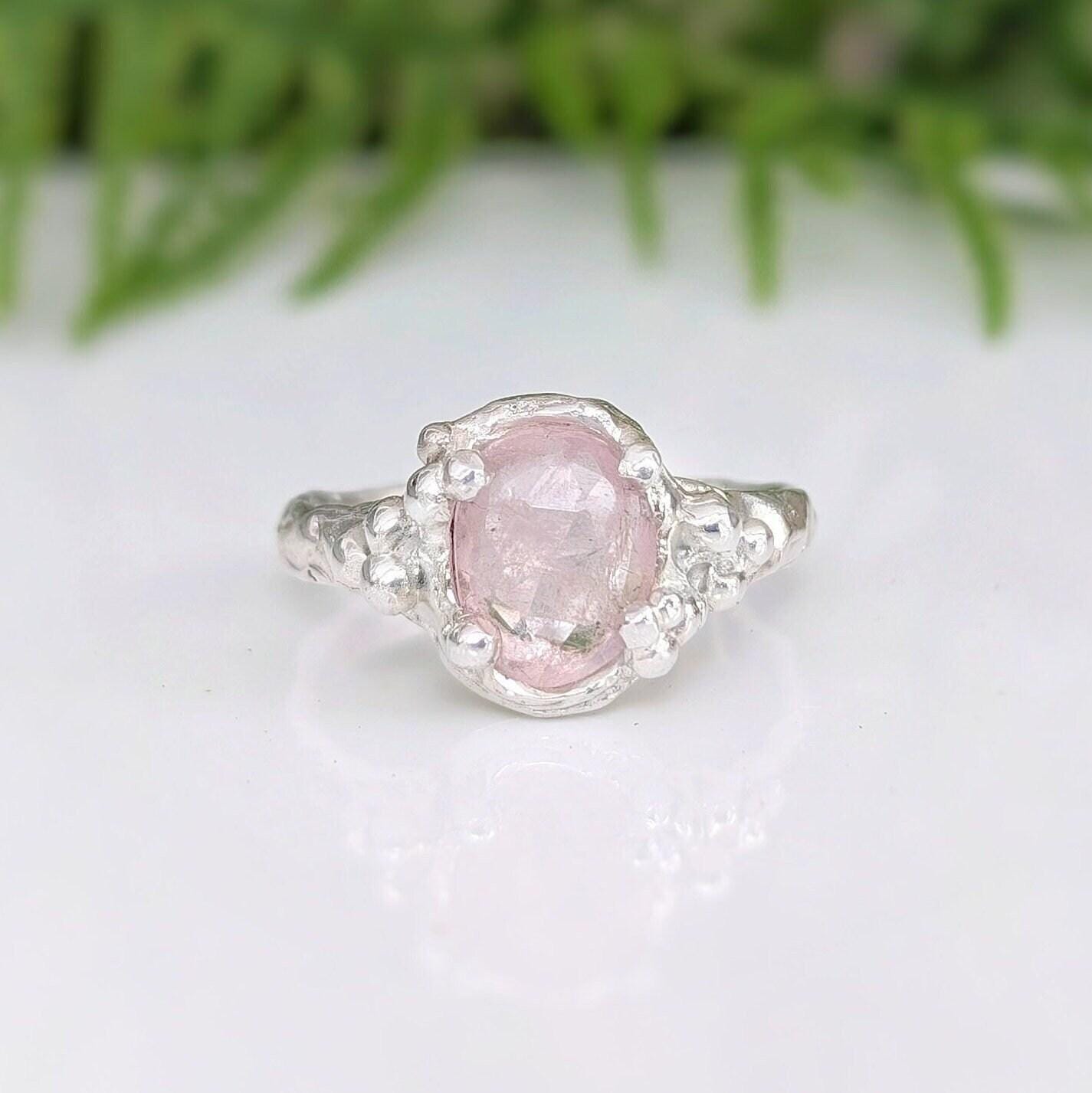 Stunning oval rose cut pink Morganite ring set in a textured silver band, showcasing elegance and daintiness.