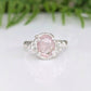 Stunning oval rose cut pink Morganite ring set in a textured silver band, showcasing elegance and daintiness.