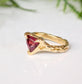 Handcrafted Rubellite Tourmaline ring in solid 14k gold with an organic textured band.