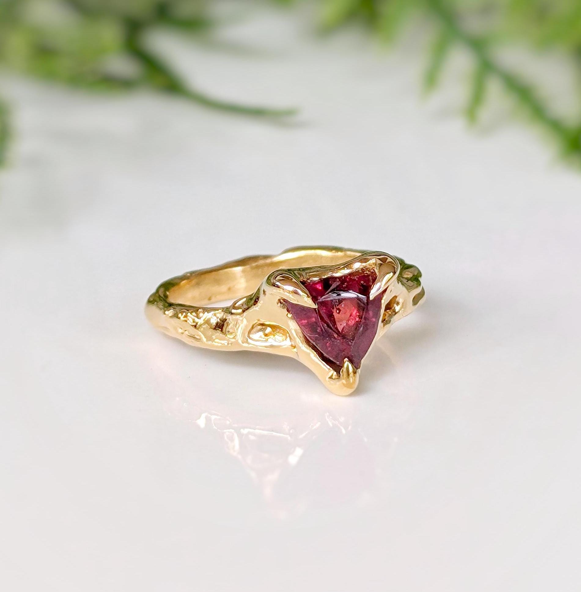 14k gold textured ring featuring a trilliant-cut dark pink Rubellite Tourmaline, perfect for engagement or special gift.
