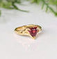 14k gold textured ring featuring a trilliant-cut dark pink Rubellite Tourmaline, perfect for engagement or special gift.