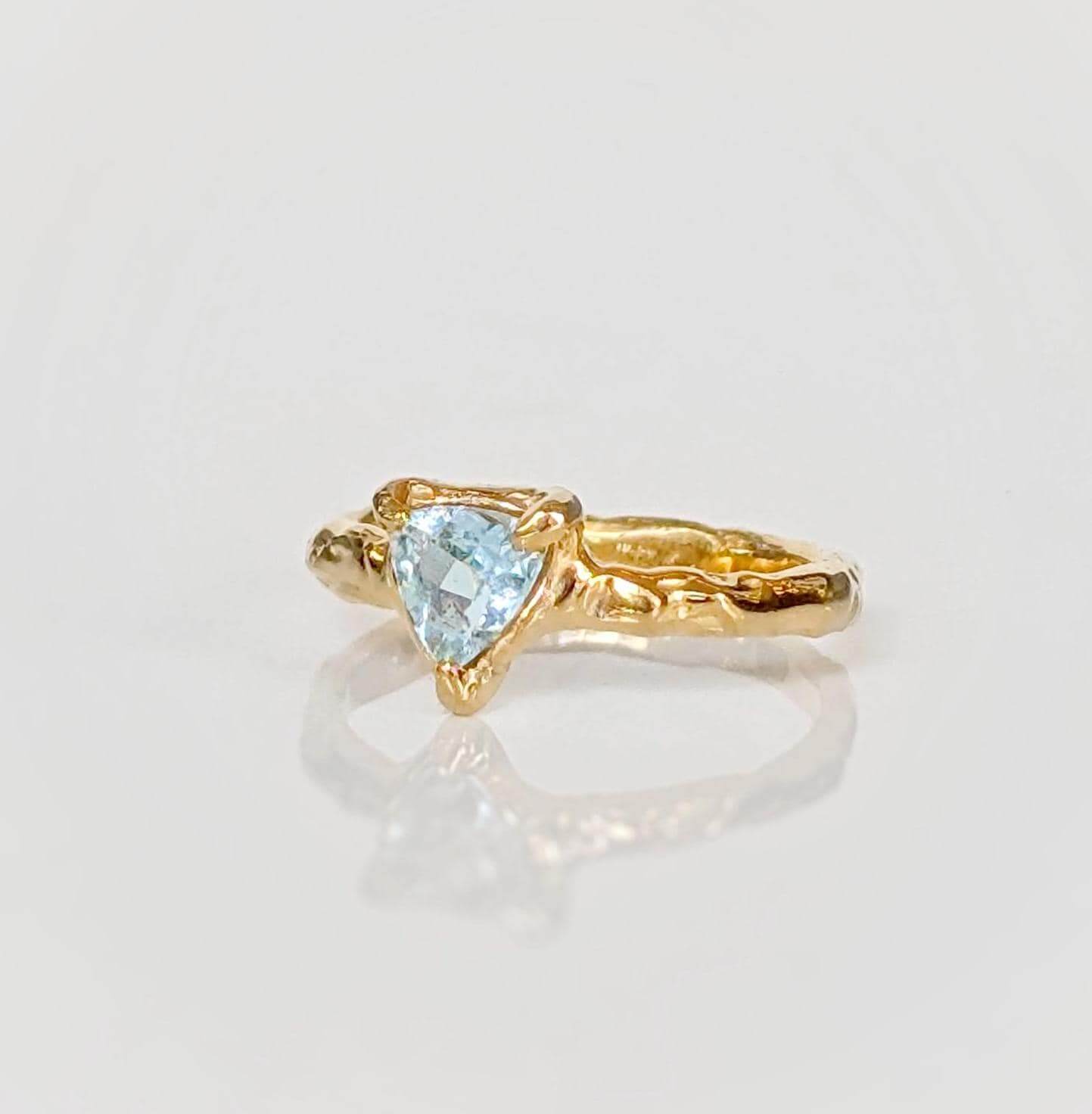 Solid Gold Aquamarine ring with organic textured band, perfect for engagement or special gifts.