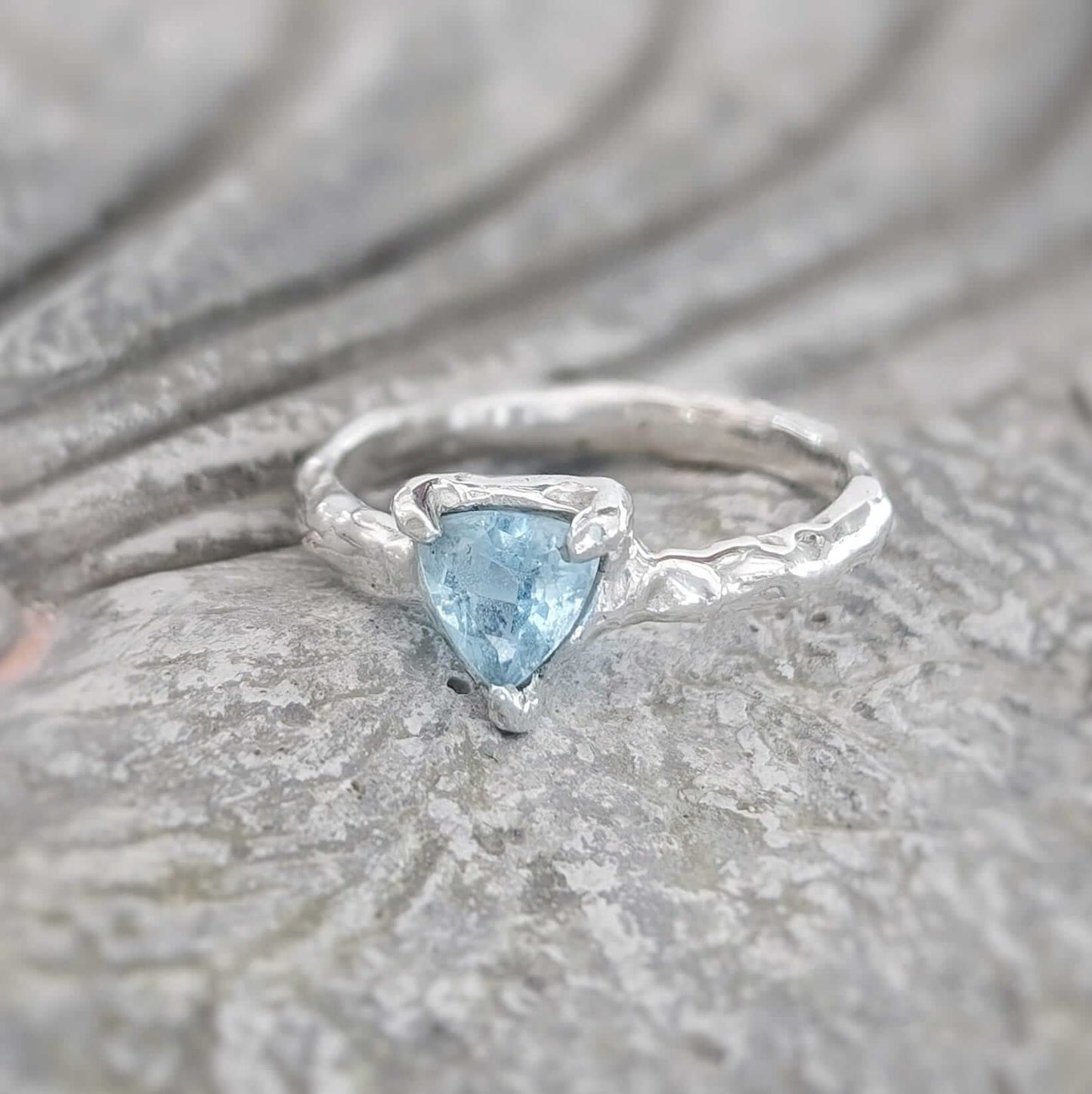Solid gold Aquamarine ring with organic textured band, perfect for engagements and gifts.