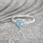 Solid gold Aquamarine ring with organic textured band, perfect for engagements and gifts.