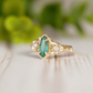 Emerald and diamond engagement ring