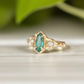 Emerald and diamond engagement ring