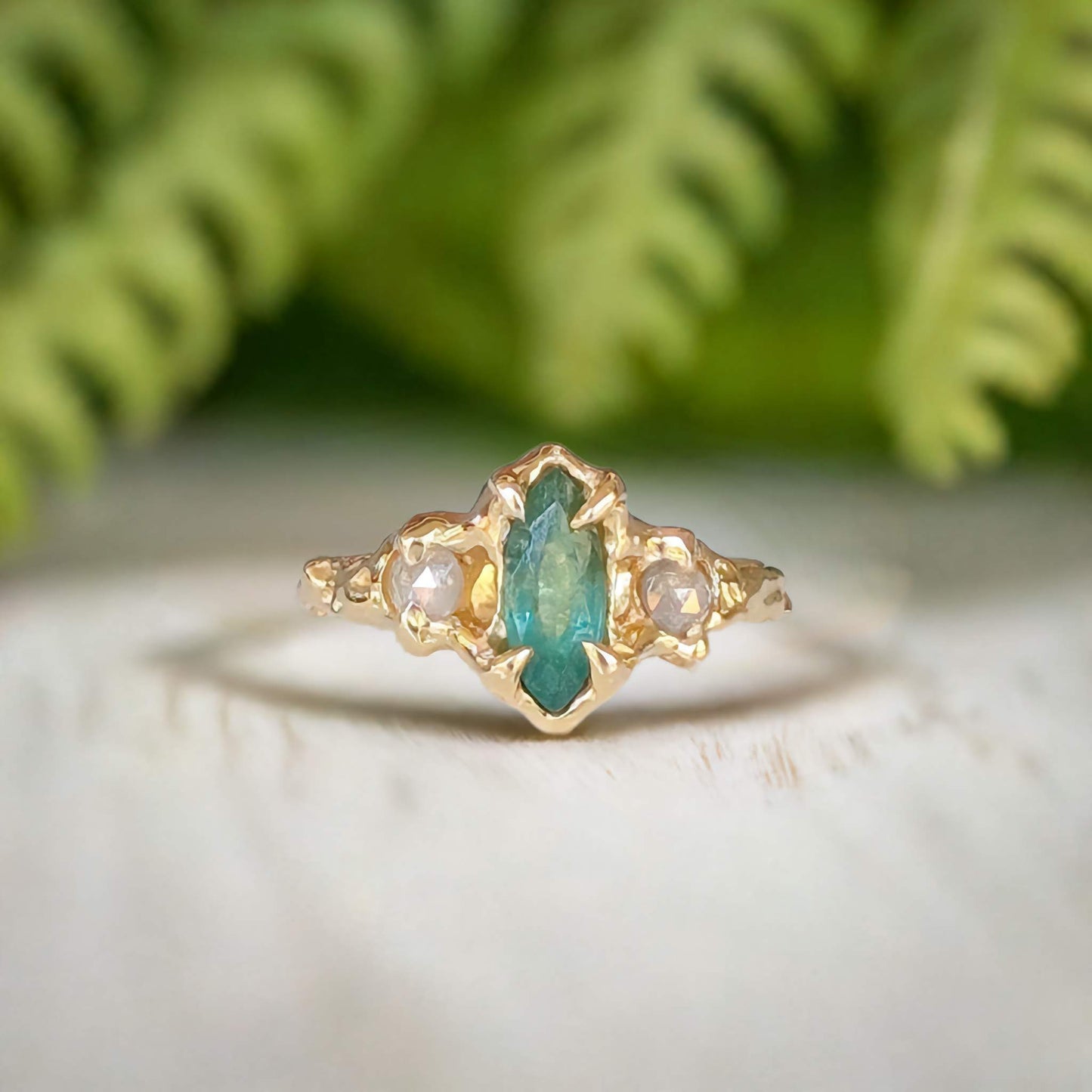 Emerald and diamond engagement ring