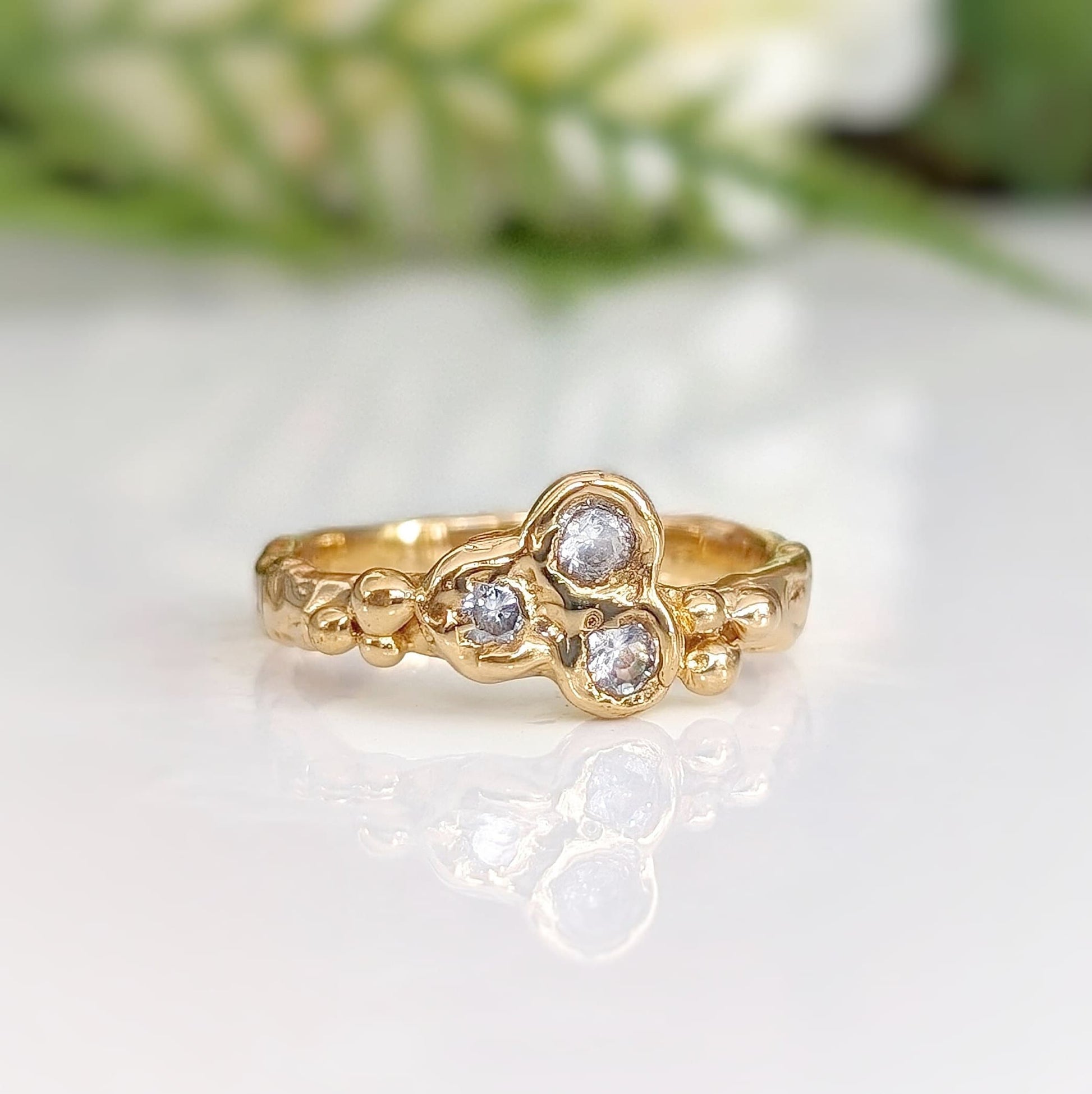 Cluster of 3 Cubic Zirconias set on a Molten Gold textured band