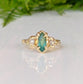 Emerald and diamond engagement ring