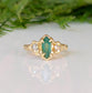 Emerald and diamond engagement ring