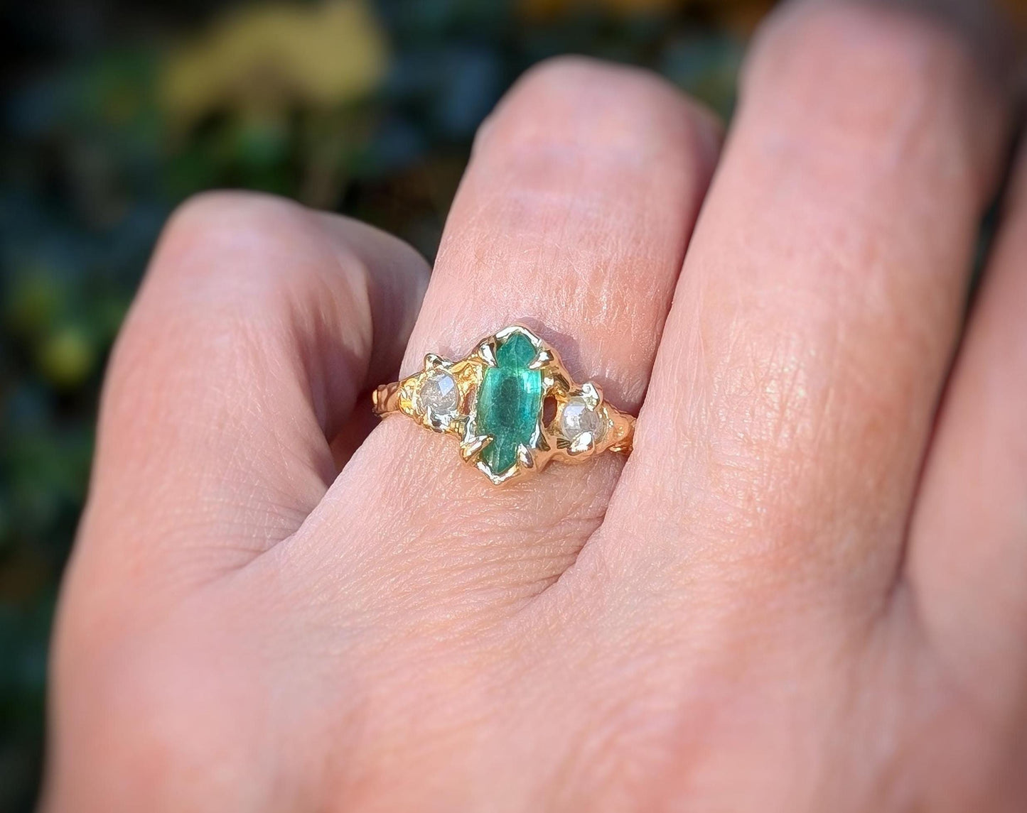 Emerald and diamond engagement ring