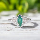 Emerald and diamond engagement ring