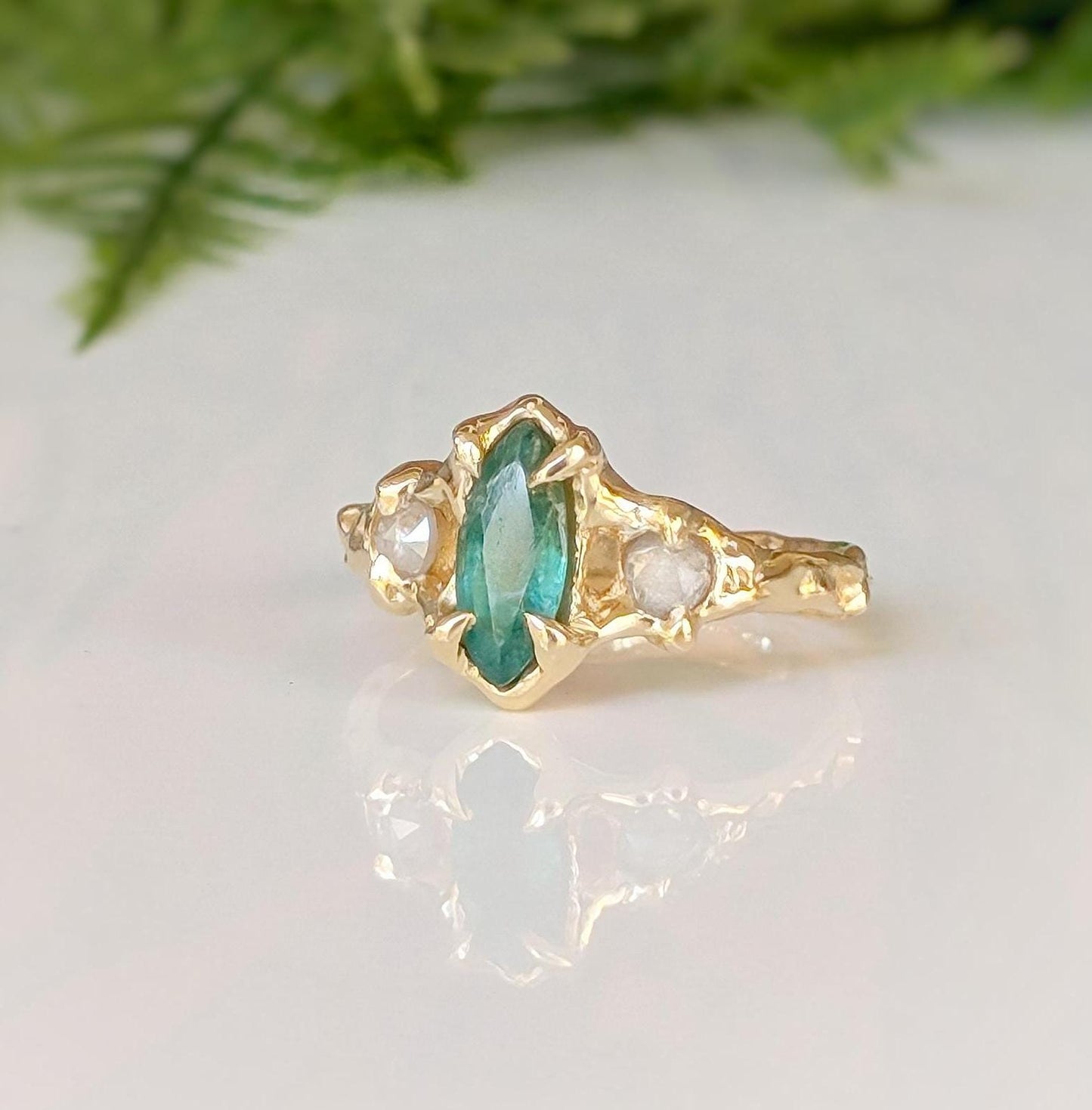 Emerald and diamond engagement ring