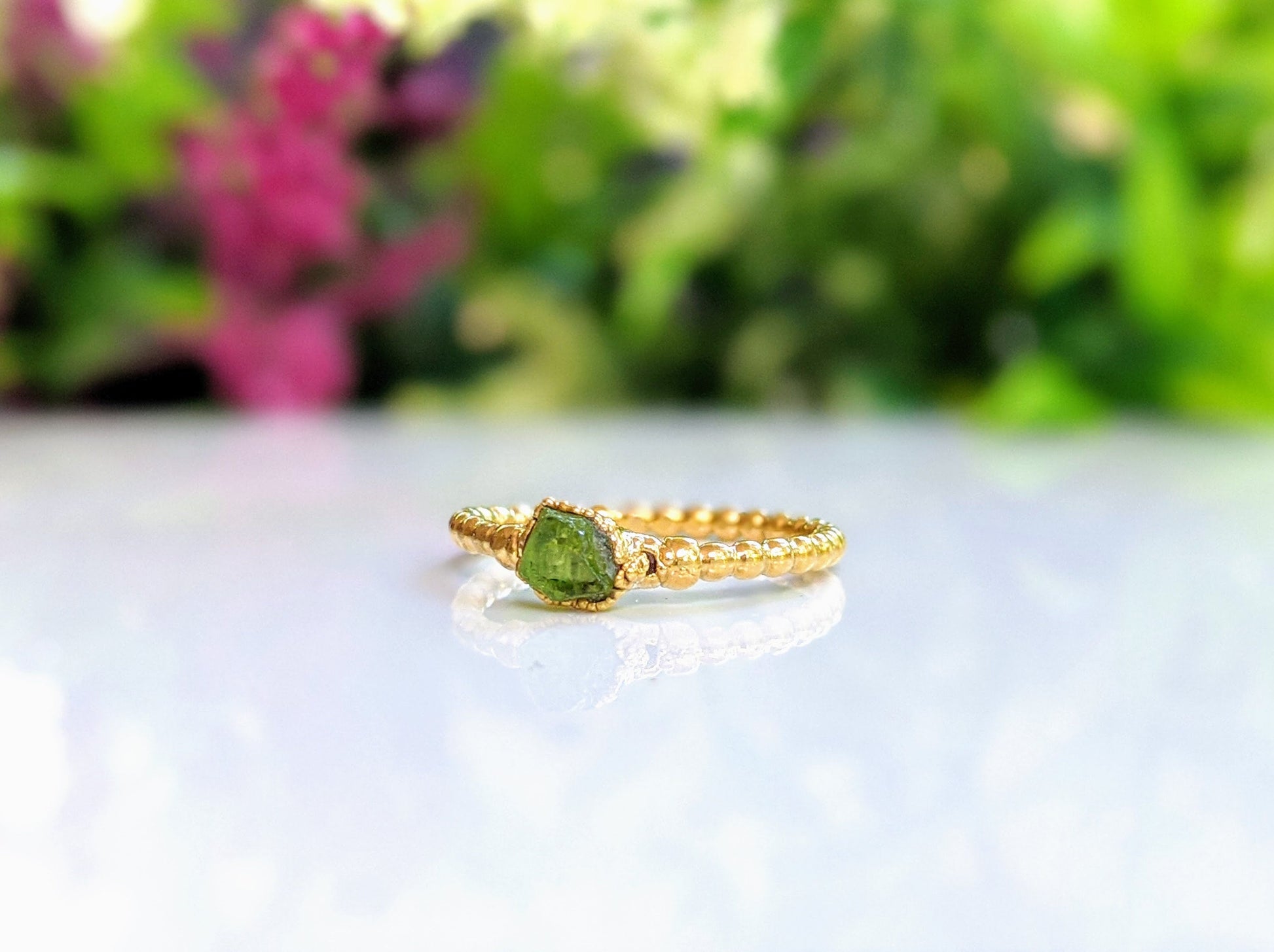 Raw Peridot beaded ring uniquely set in 18k Gold
