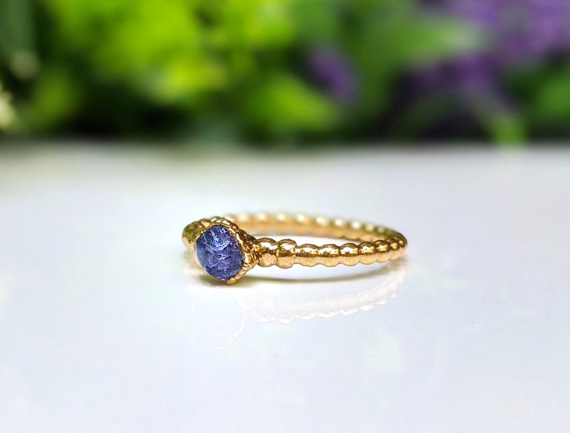 Raw Tanzanite beaded ring uniquely set in 18k Gold