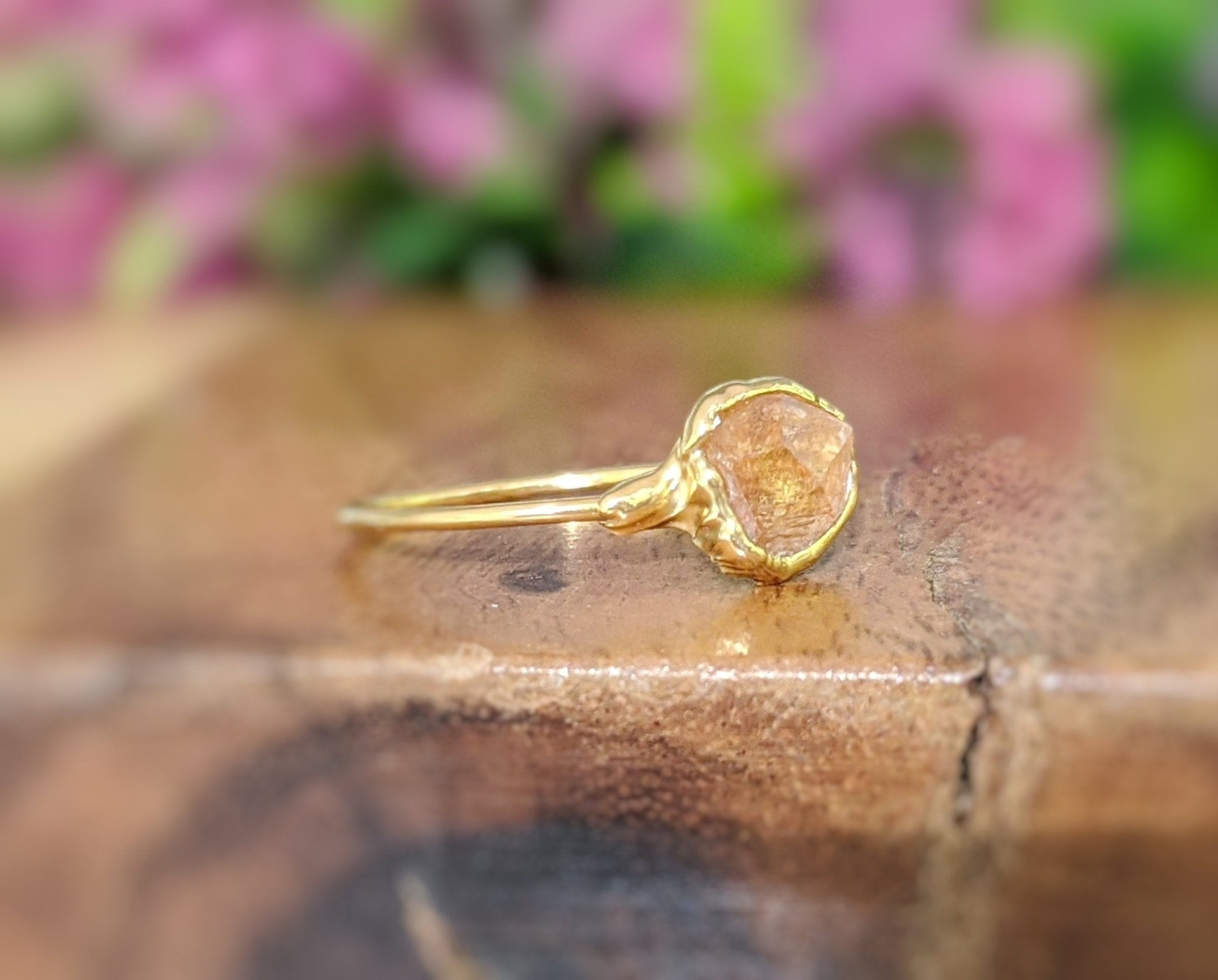 Raw Hessonite Garnet ring uniquely set in 18k Gold
