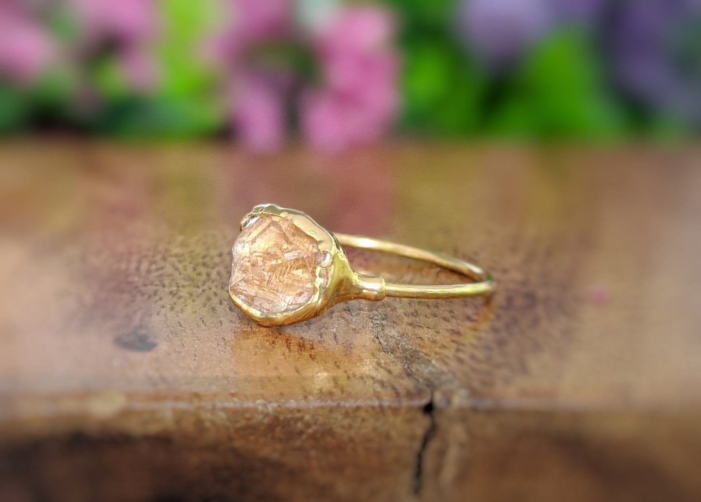 Raw Hessonite Garnet ring uniquely set in 18k Gold