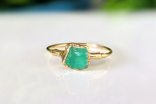 Raw Emerald ring set in unique 18k Gold setting