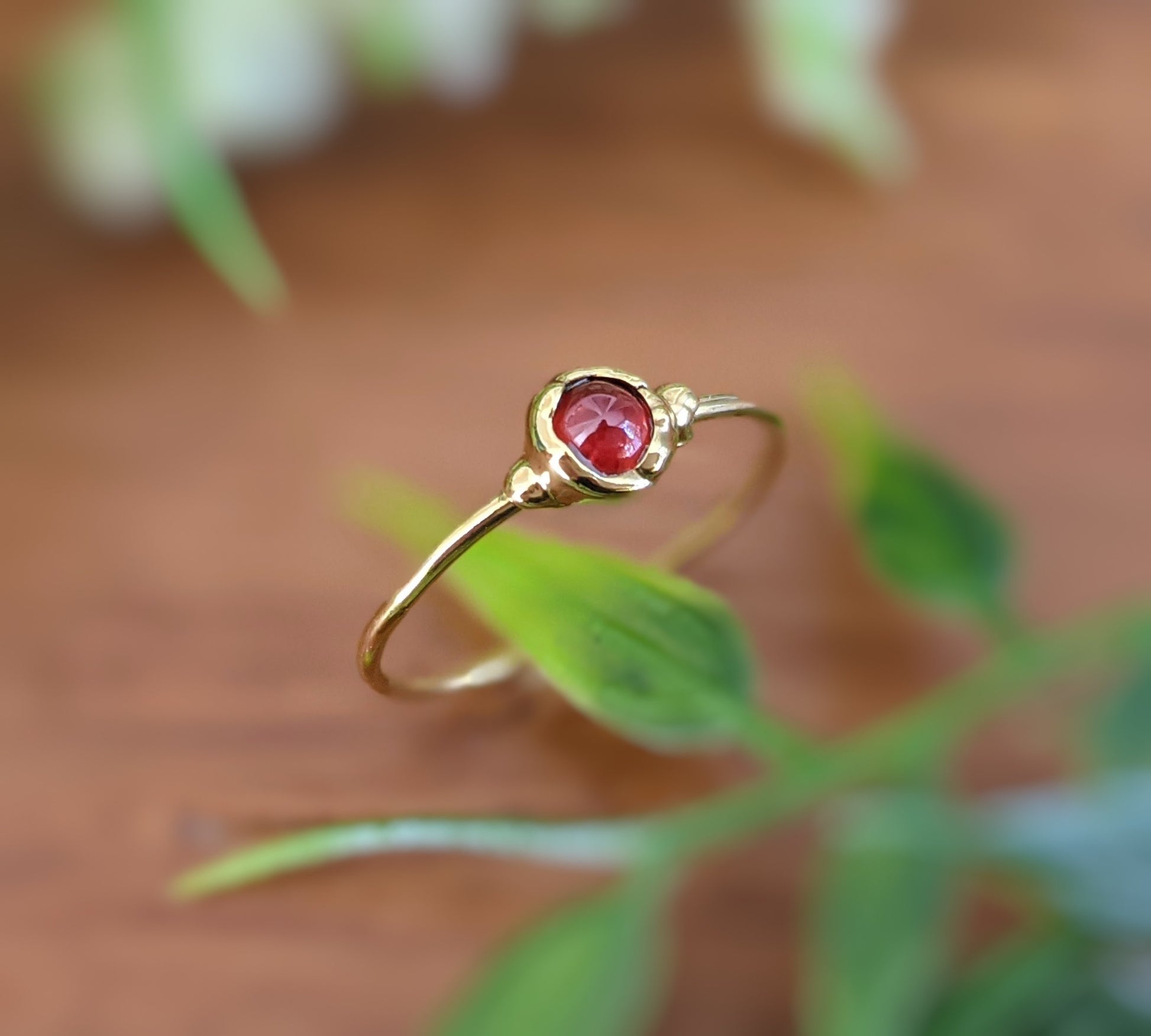 Dainty Garnet January birthstone stacking ring in unique 18k Gold setting