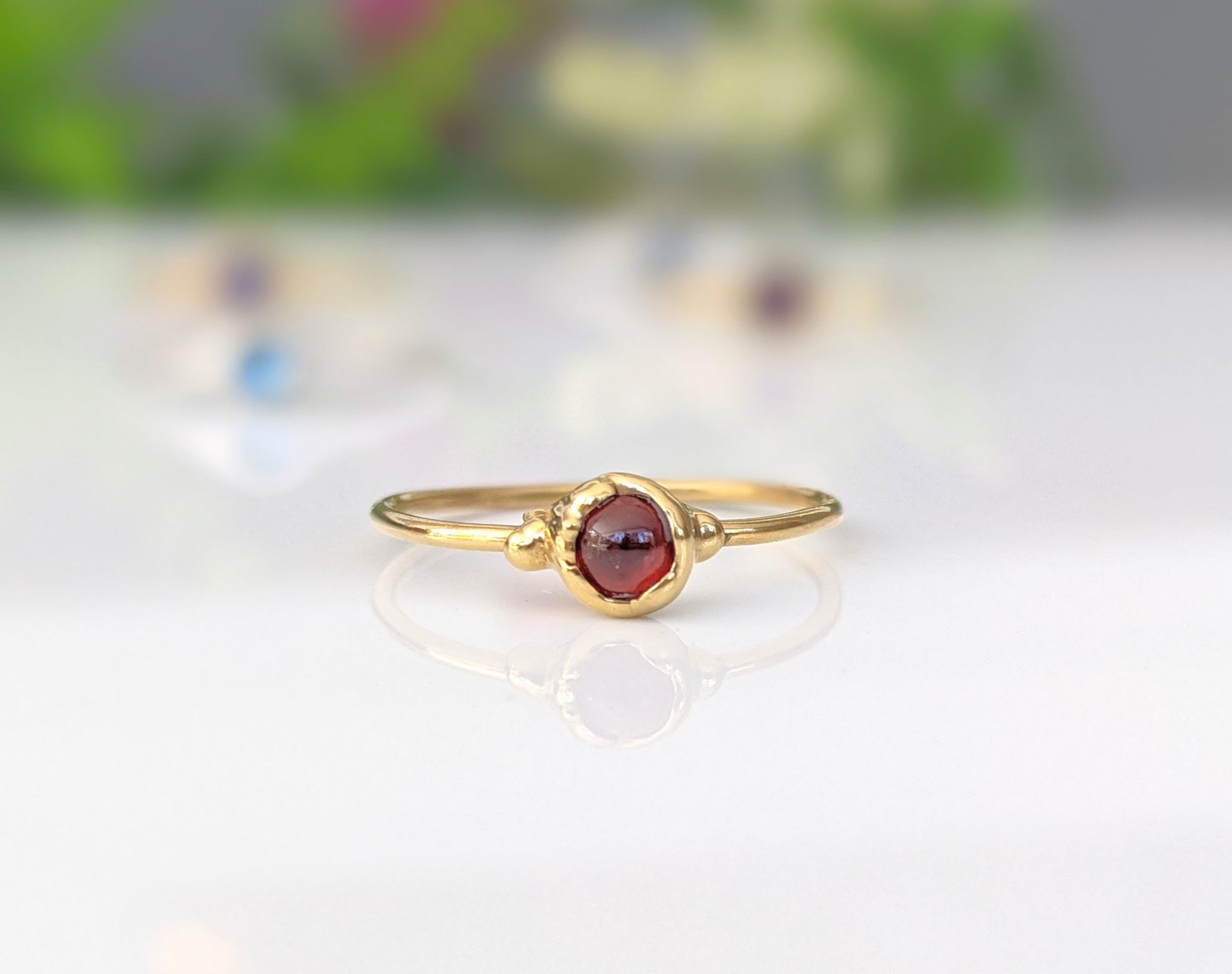 Dainty Garnet January birthstone stacking rings in unique 18k Gold setting