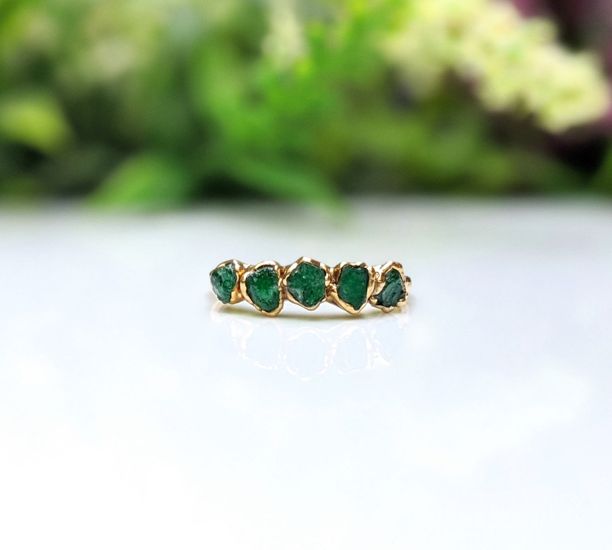 Raw Emerald half Eternity ring uniquely set in 18k Gold 