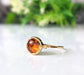 Round Baltic Amber ring in unique 18k Gold setting