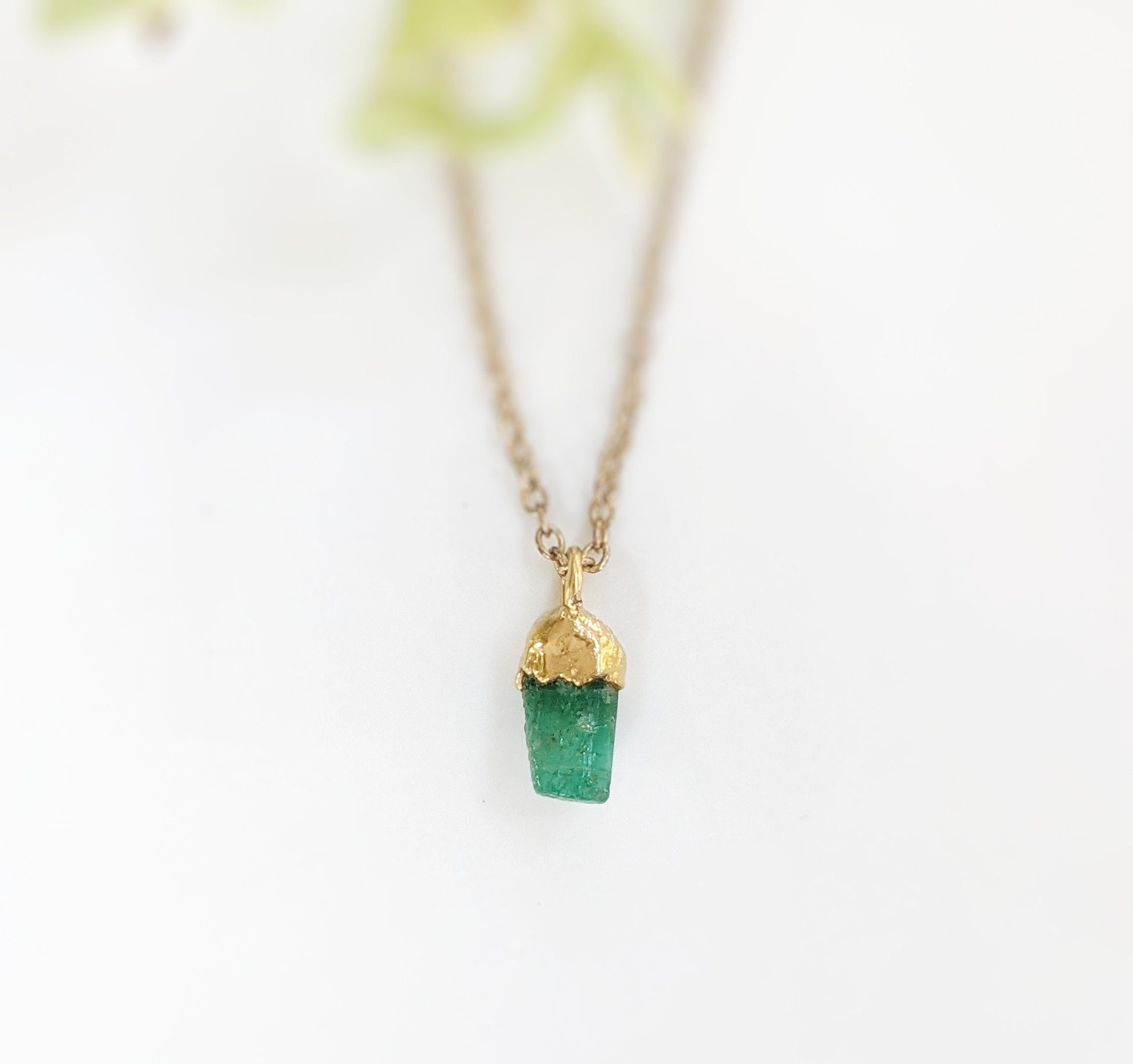 Raw Emerald Necklace uniquely set in 18k Gold