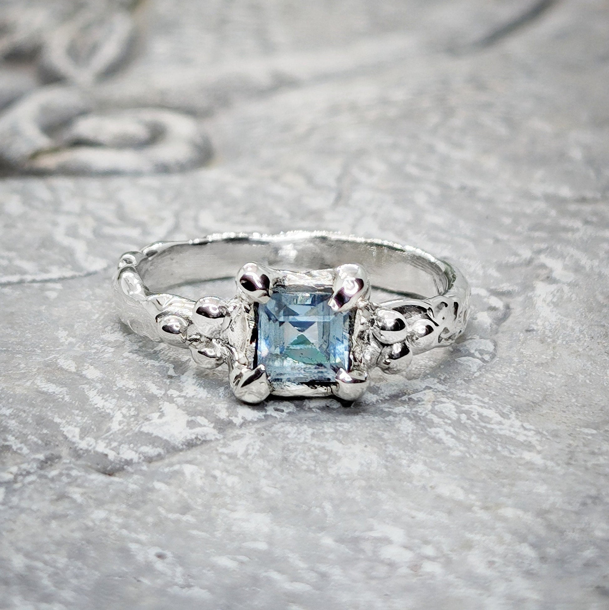 Square Blue topaz set on a Molten Silver textured band