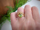 Large Pear shape Peridot set by prongs on a textured Molten Solid 14k Gold band