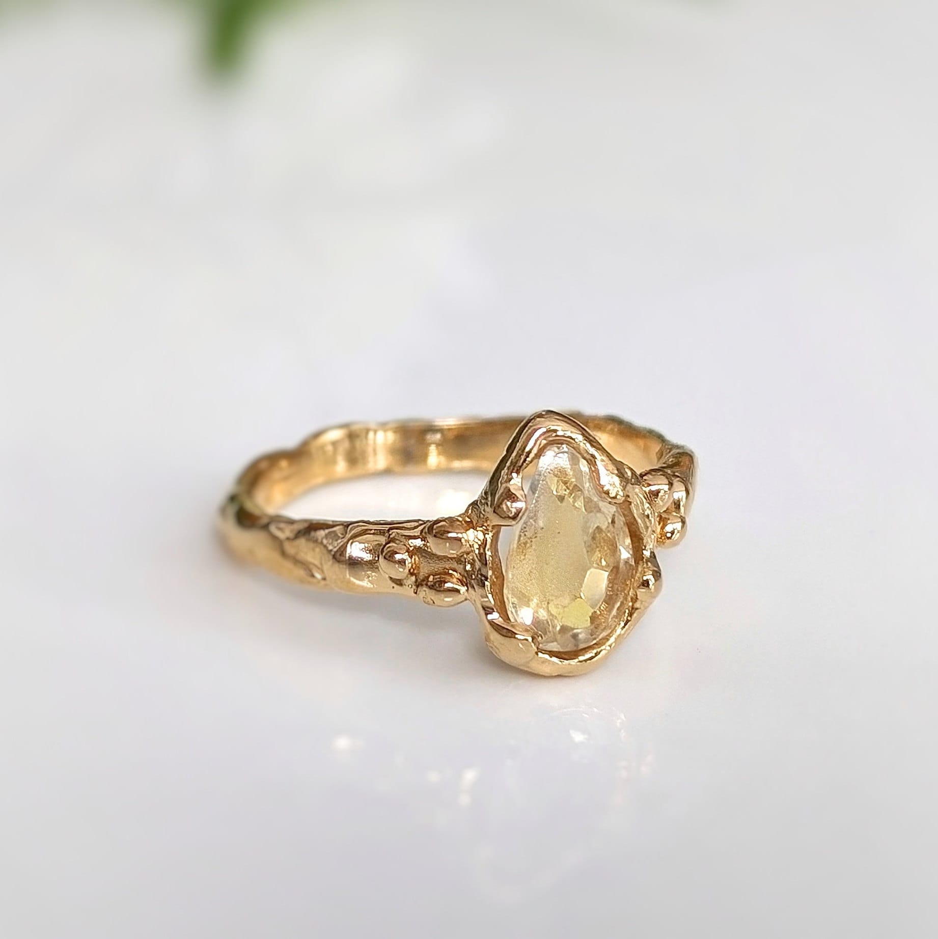 Large Pear shape Citrine set by prongs on a Solid 14k Gold Molten textured band