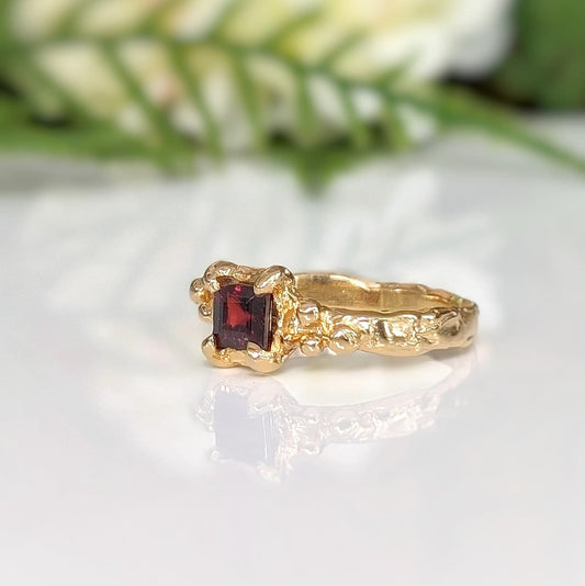 Red square Garnet set by prongs on a Solid 14k Gold Molten textured band