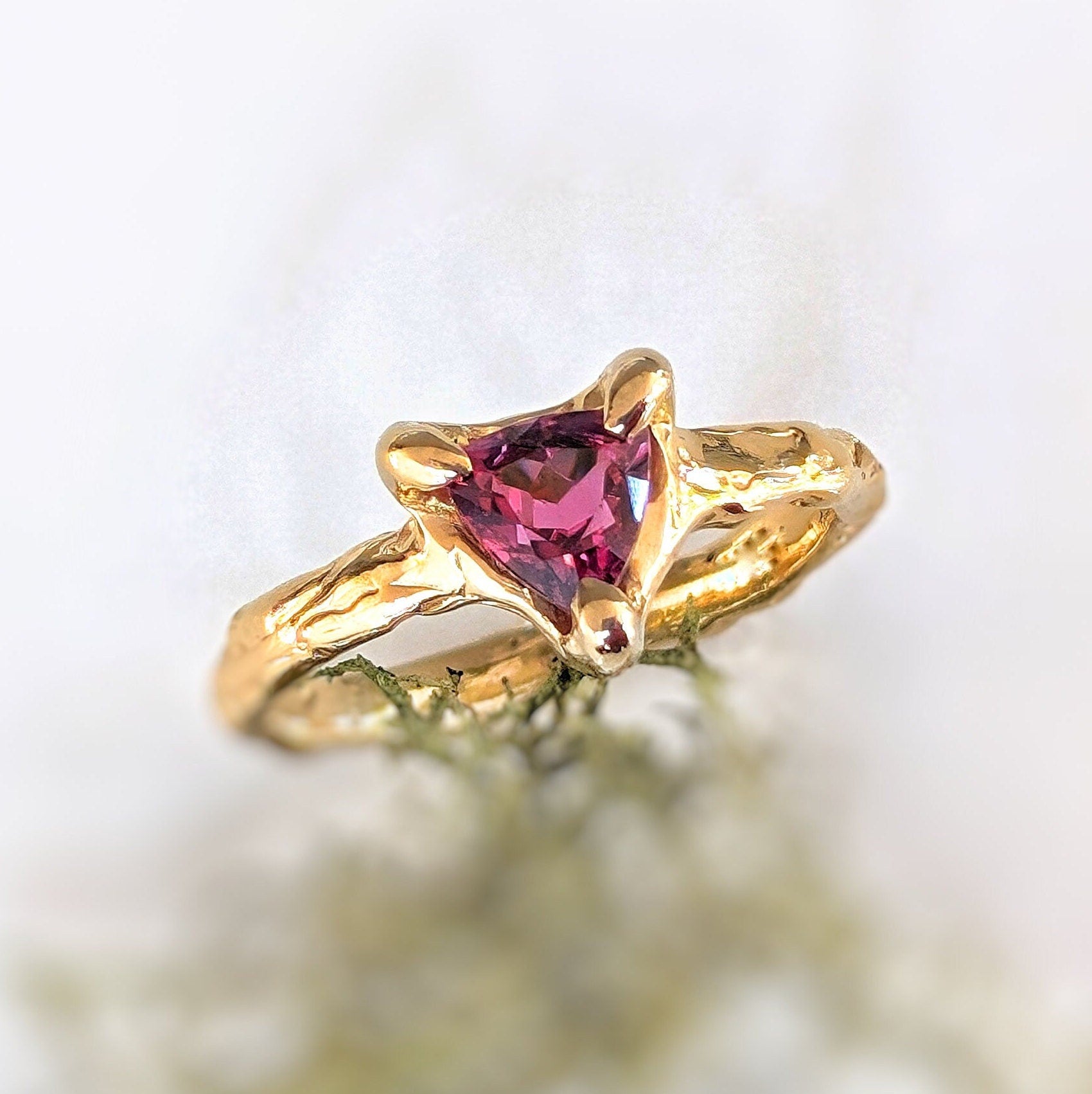 Trilliant shape Rubellite Tourmaline set by prongs on a textured Solid 14k Gold band