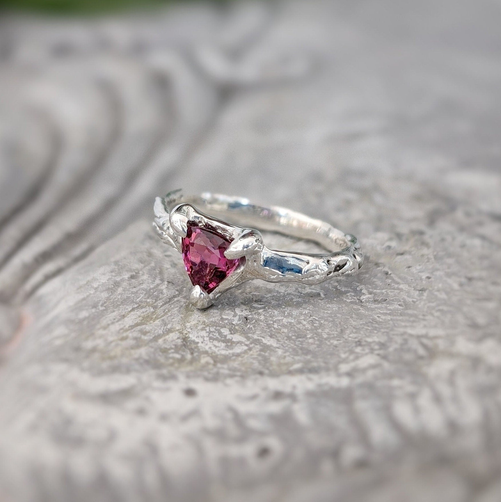 Trilliant shape Rubellite Tourmaline set by prongs on a textured Solid Sterling Silver band